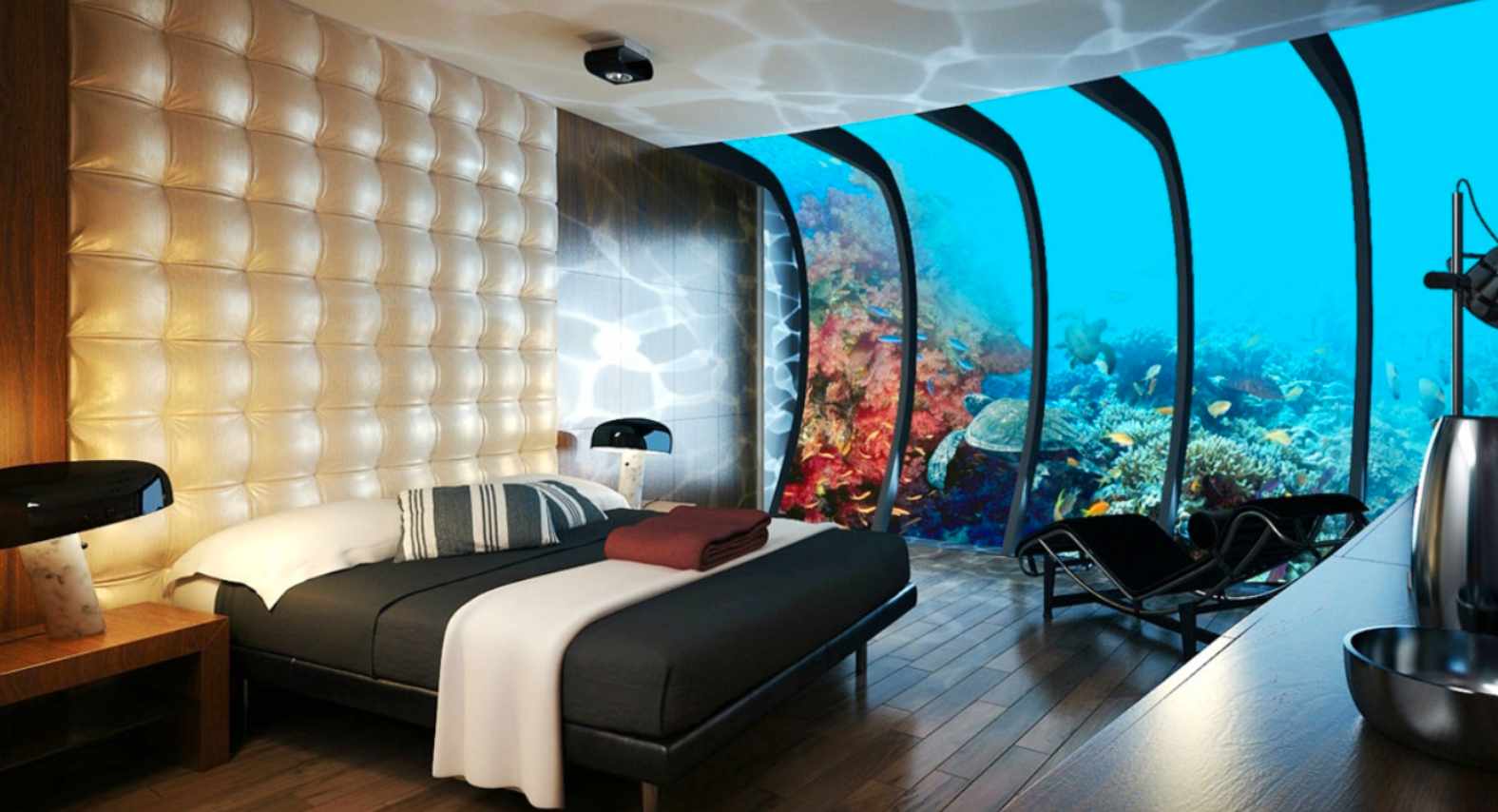 Underwater hotel room with coral reef view.