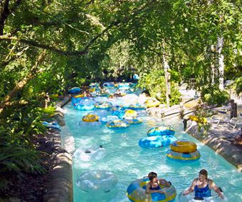 A group of people in tubes on water
